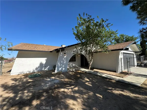 a view of a house with a tree