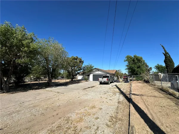 a view of a backyard of the house