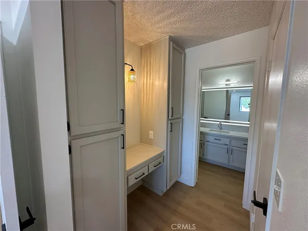 a bathroom with a bathtub sink and mirror