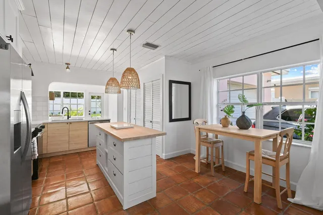 a kitchen with a cabinets and chairs