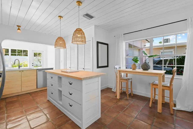 a view of a kitchen with cabinets