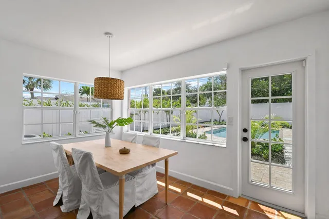 a kitchen with a table and chairs