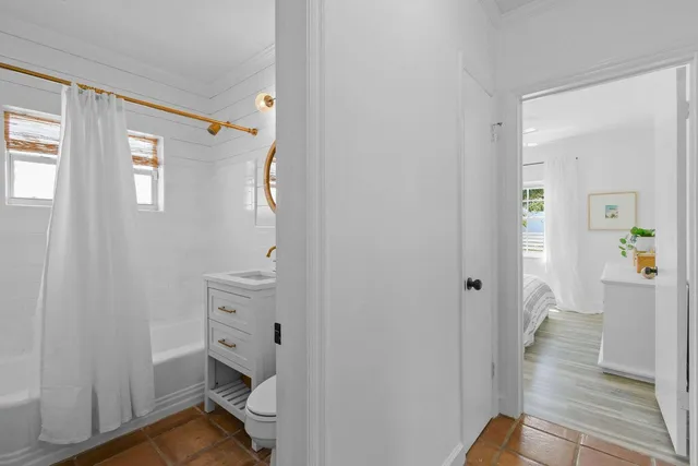 a bathroom with a sink and toilet