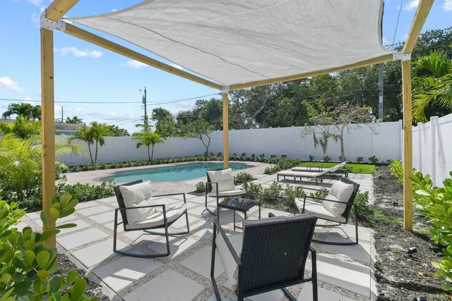 a view of an chairs and tables in the patio