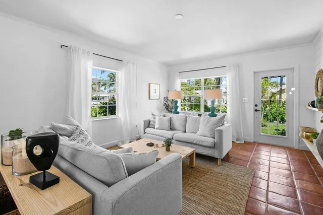 a living room with furniture and window