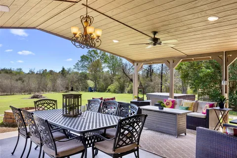a view of a patio with a table chairs and a patio