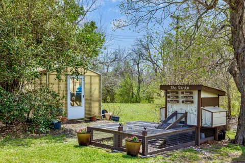 a view of a backyard with sitting area