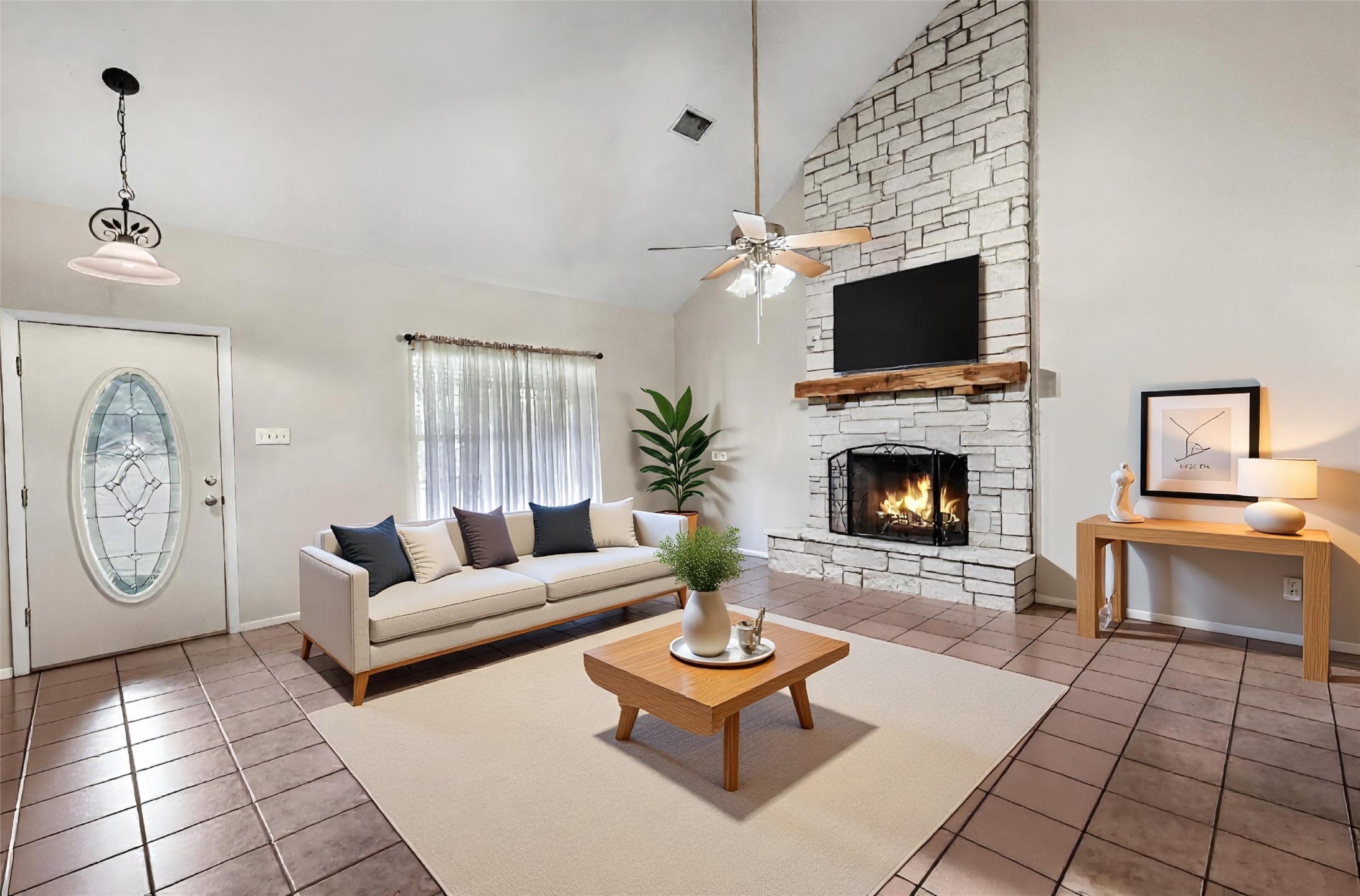 999 Salem Road Brenham, TX 77833 - Photo 24 of 41 a living room with furniture a flat screen tv and a fireplace