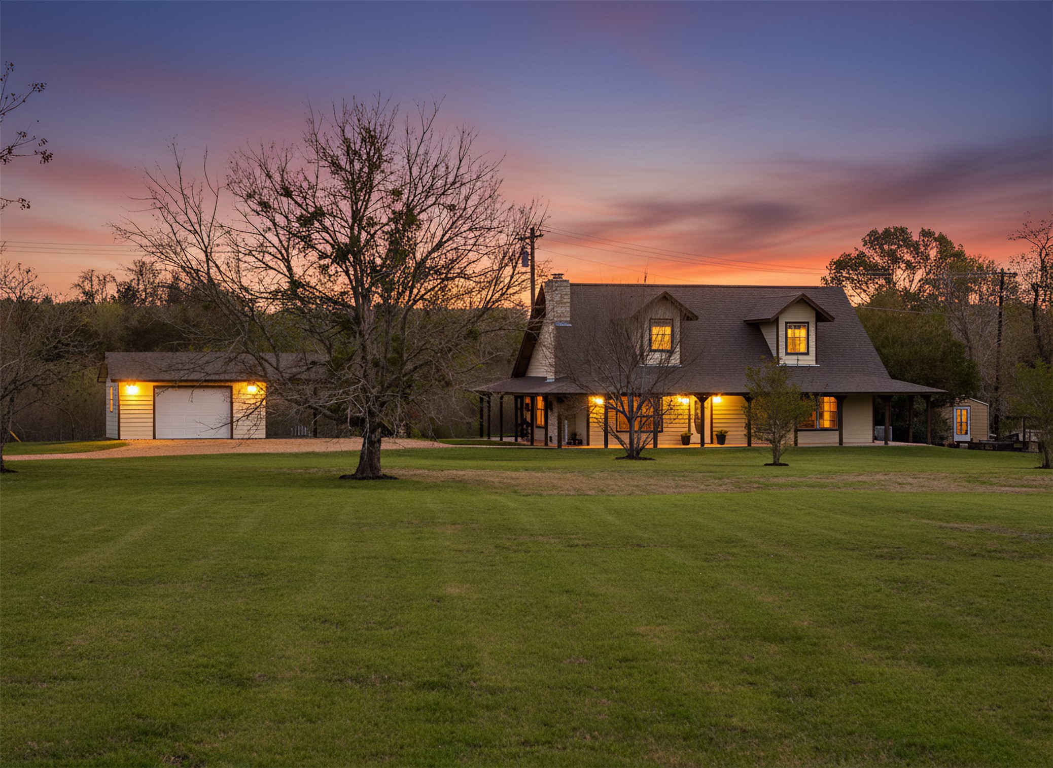 999 Salem Road Brenham, TX 77833 - Photo 3 of 41 a front view of a house with a big yard