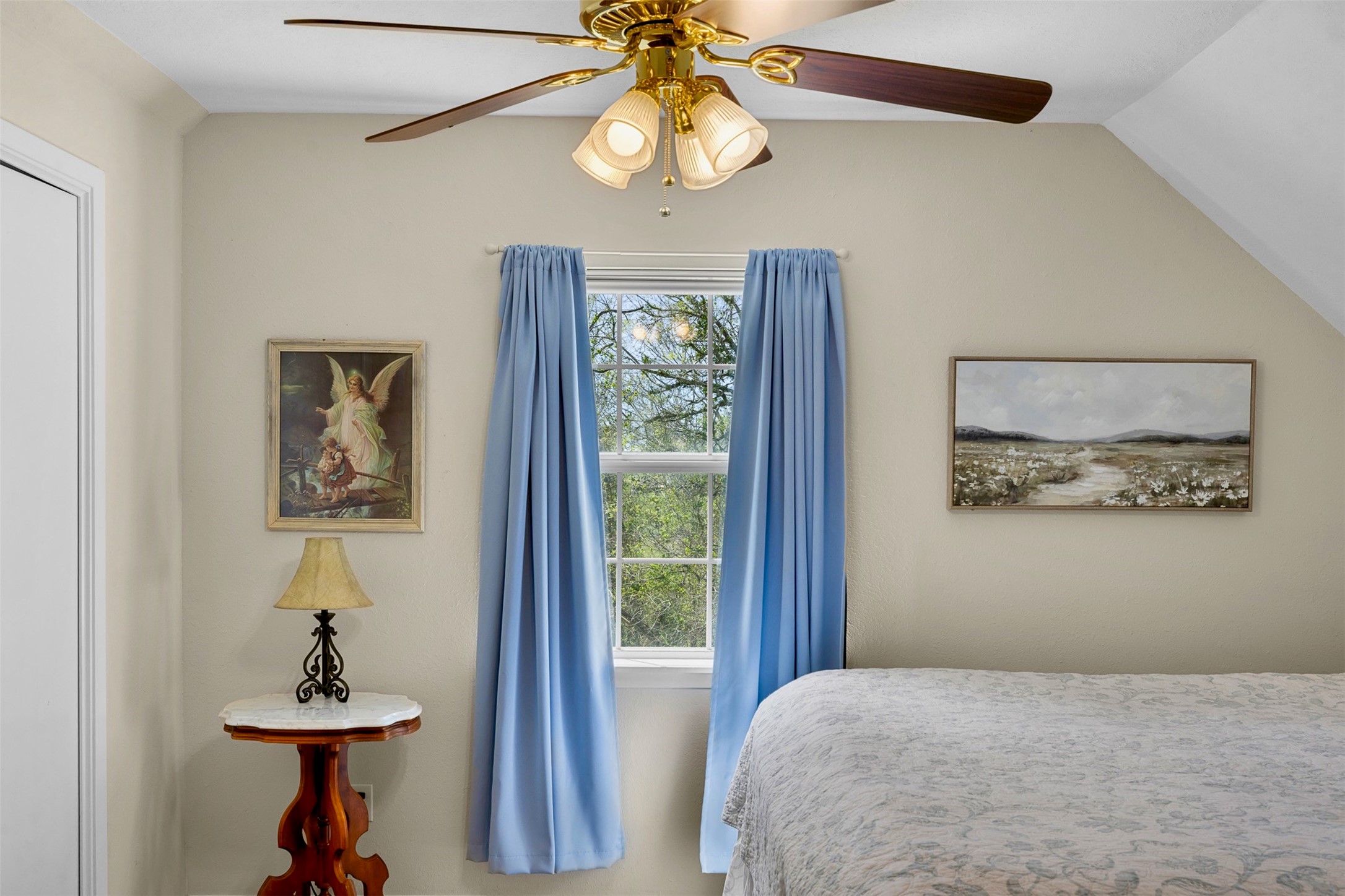 999 Salem Road Brenham, TX 77833 - Photo 36 of 41 a bedroom with a bed and a chandelier