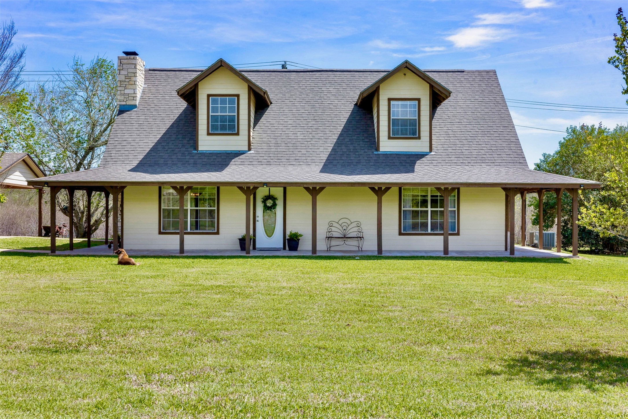999 Salem Road Brenham, TX 77833 - Photo 7 of 41 a front view of a house with garden