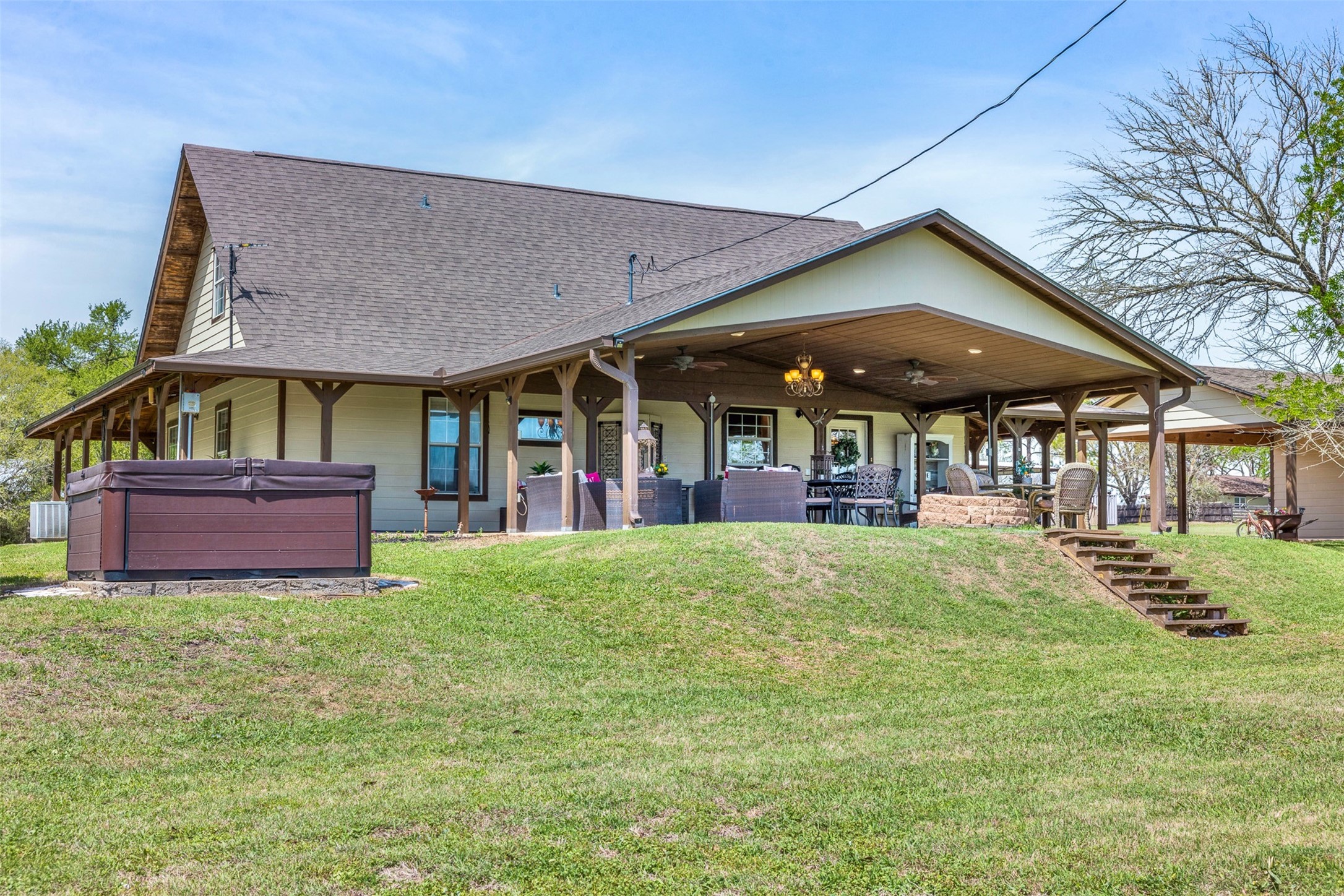 999 Salem Road Brenham, TX 77833 - Photo 9 of 41 a view of an house with backyard space and porch