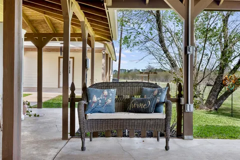 a wooden bench sitting in front of a building