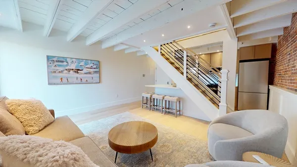 a living room with furniture and a table