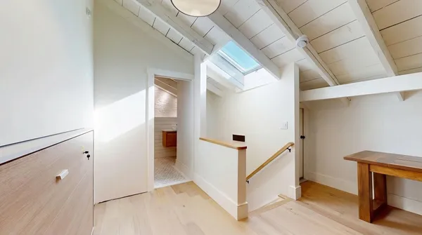 a view of a hallway with staircase