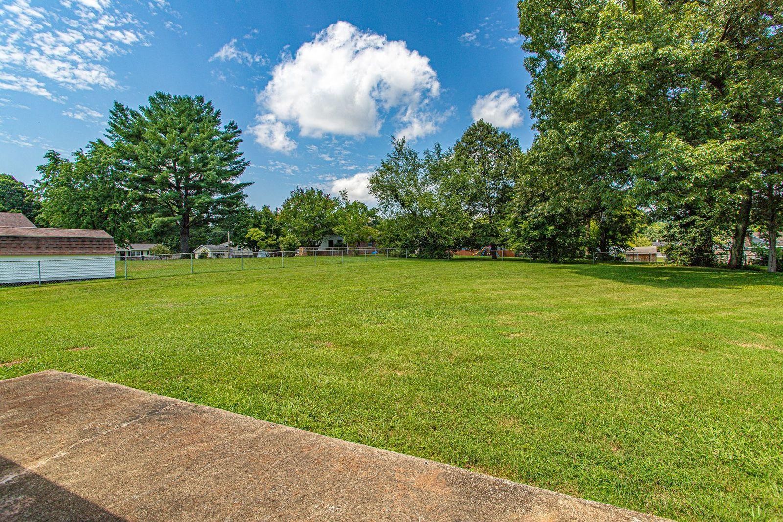 5509 Inwood Road Northwest Knoxville, TN 37921 - Photo 5 of 40 a view of a big yard with a fountain
