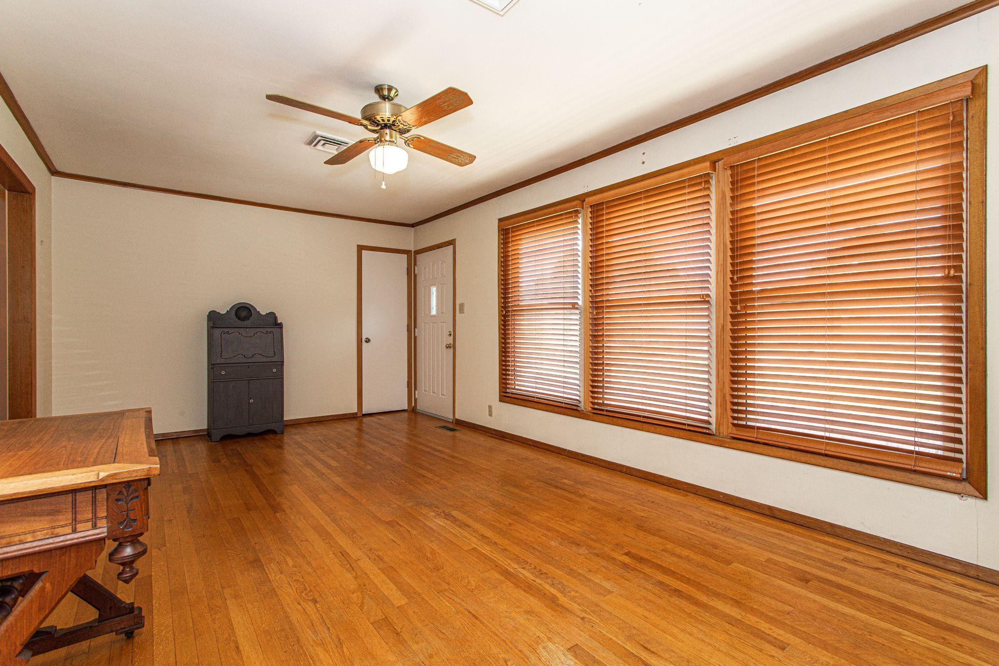 5509 Inwood Road Northwest Knoxville, TN 37921 - Photo 8 of 40 a view of a livingroom with a ceiling fan and window