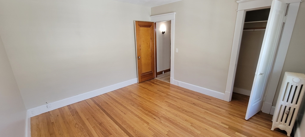 74 Melha Avenue Springfield, MA 01104 - Photo 12 of 16 a view of a room with wooden floor and stairs