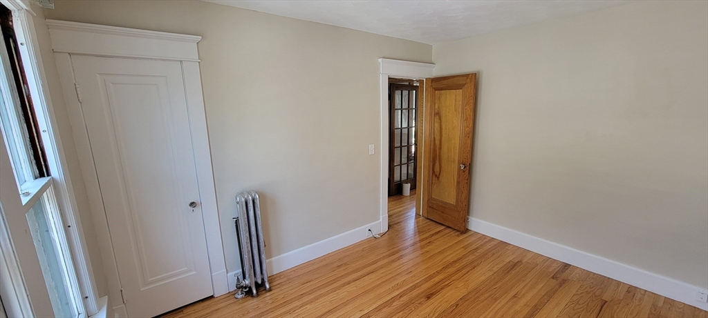 74 Melha Avenue Springfield, MA 01104 - Photo 15 of 16 a view of empty room with wooden floor