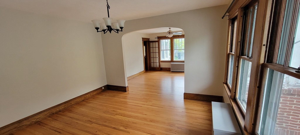74 Melha Avenue Springfield, MA 01104 - Photo 3 of 16 a view of a hallway view with wooden floor and staircase