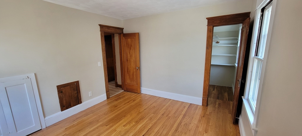 74 Melha Avenue Springfield, MA 01104 - Photo 8 of 16 a view of hallway with wooden floor