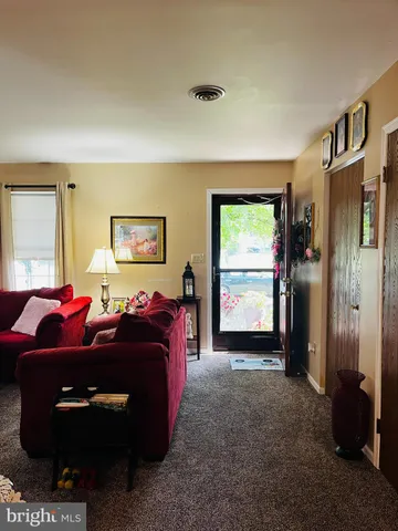 a room with furniture and a chandelier