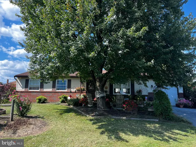 front view of house with a yard balcony