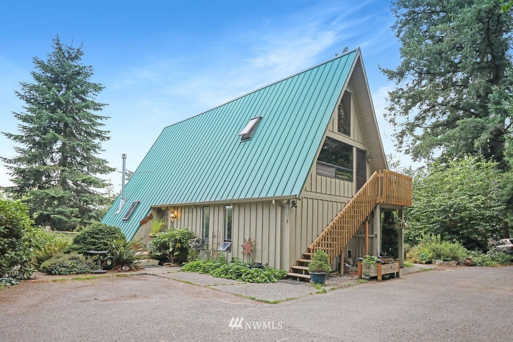 15307 Baker Heights Road Mount Vernon, WA 98273 - Photo 2 of 37 a view of a house with a park