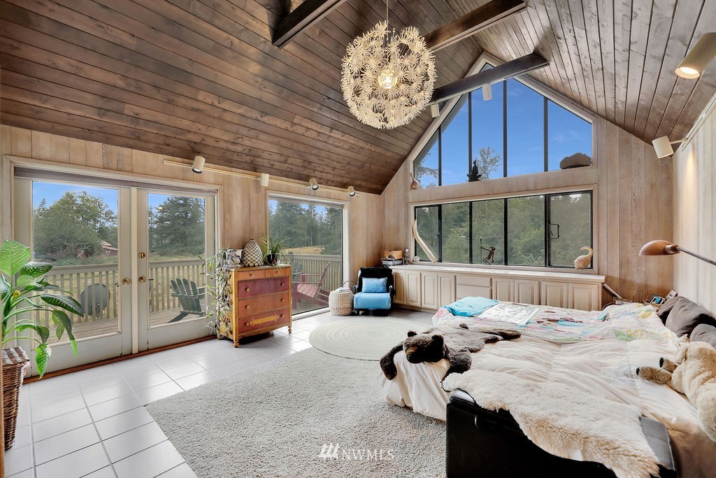 15307 Baker Heights Road Mount Vernon, WA 98273 - Photo 13 of 37 a bedroom with furniture and large windows