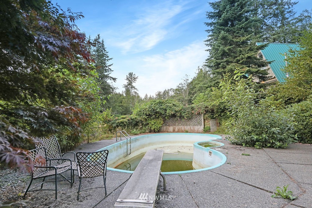 15307 Baker Heights Road Mount Vernon, WA 98273 - Photo 26 of 37 a view of a swimming pool with sitting area