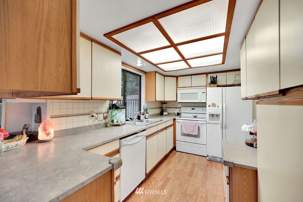 15307 Baker Heights Road Mount Vernon, WA 98273 - Photo 10 of 37 a kitchen with a sink cabinets and window