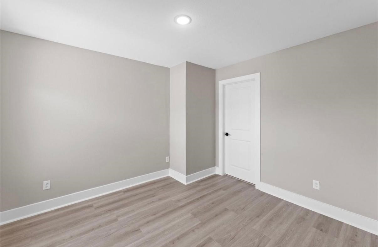 2606 Liguria Ln Spring Spring, TX 77388 - Photo 20 of 29 a view of an empty room with wooden floor