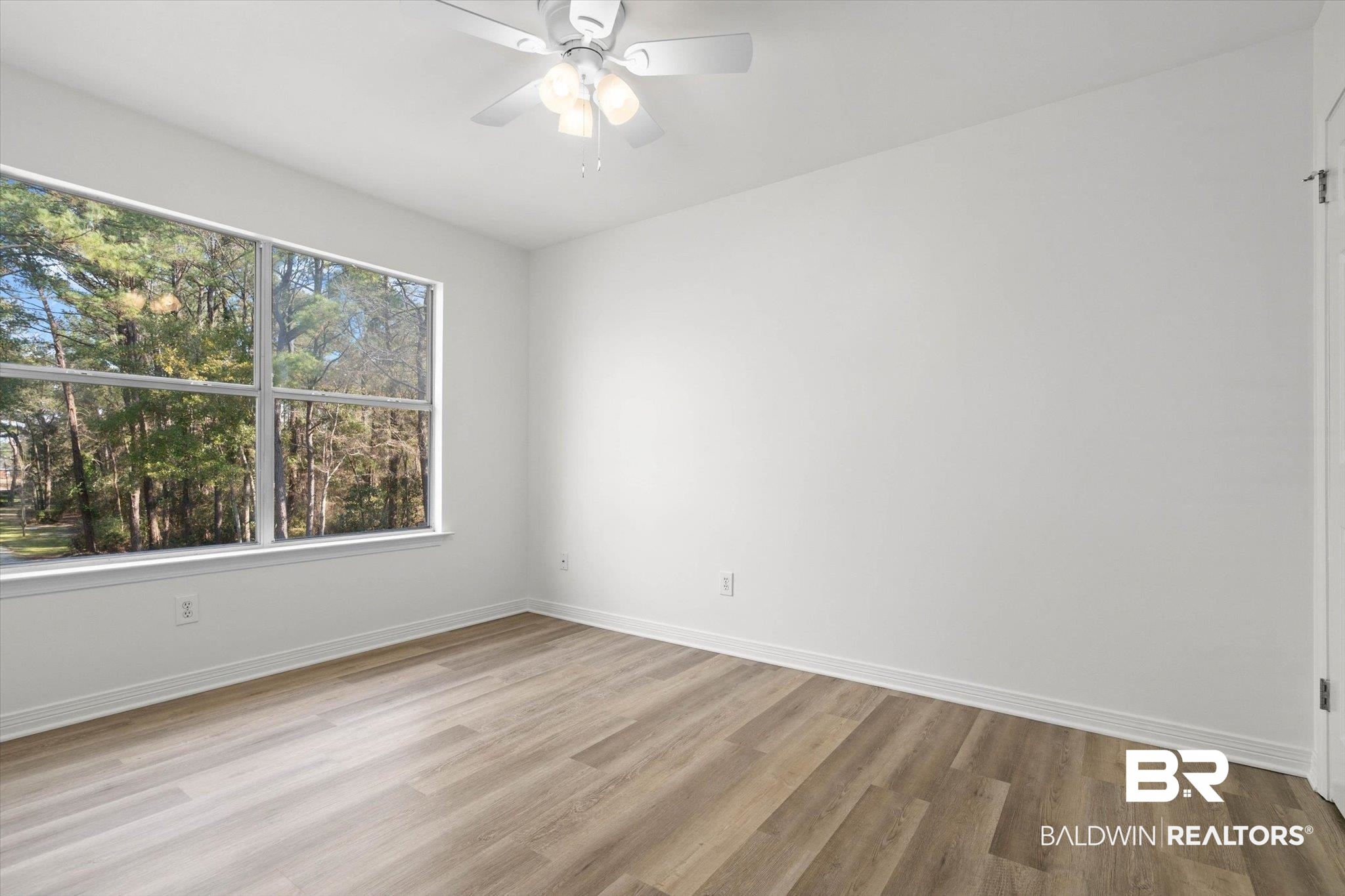 3847 Riviere Du Chien Road Mobile, AL 36693 - Photo 21 of 51 Spare room with ceiling fan and light wood-style floors