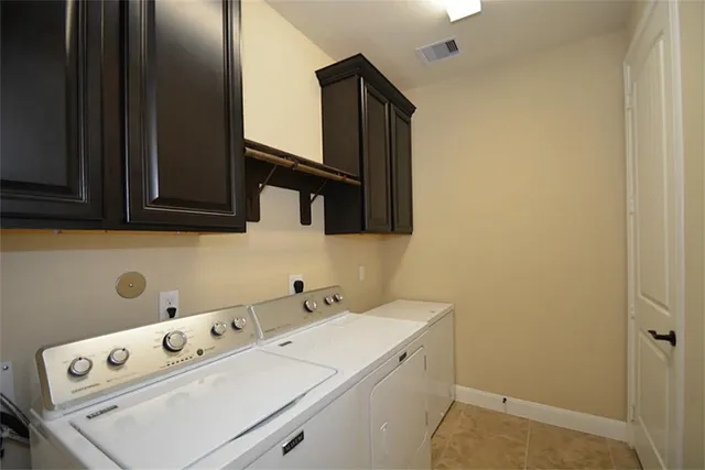 a spacious bedroom with a bed and a ceiling fan