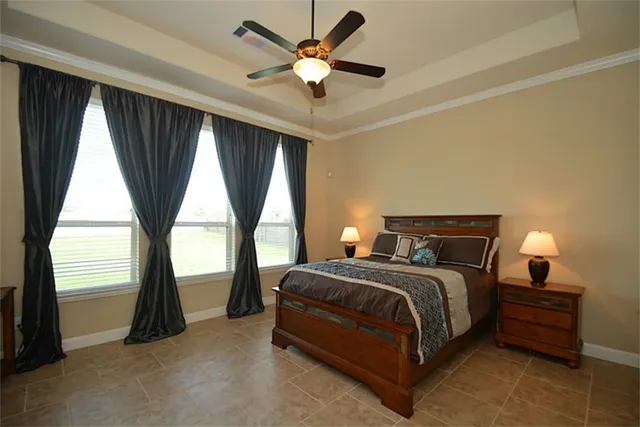 a bathroom with a tub sink shower and mirror