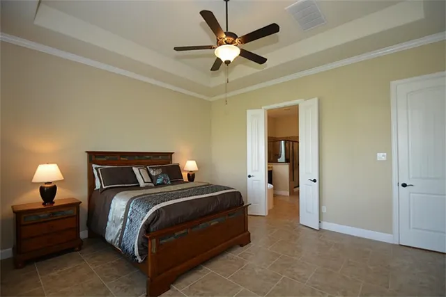 a bathroom with a granite countertop sink mirror and tub