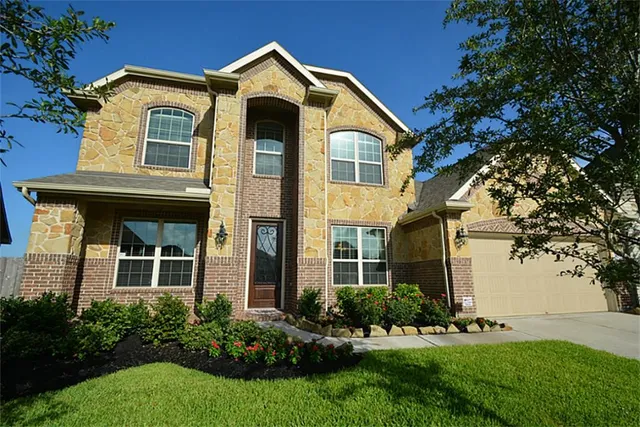 a view of a dining room with furniture and window