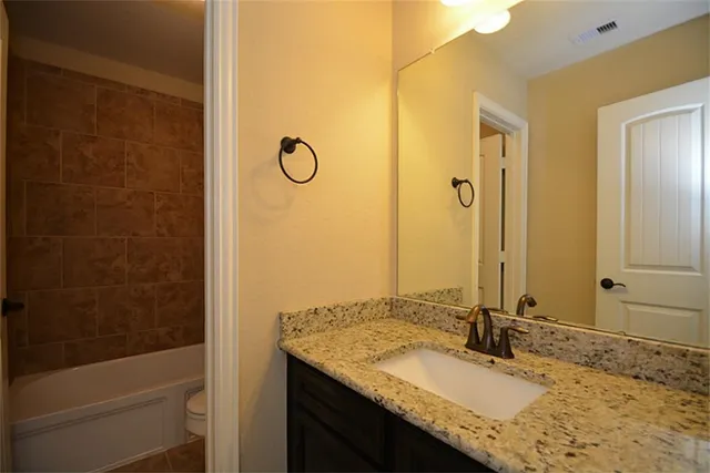 a view of a yard with a large tree and a yard