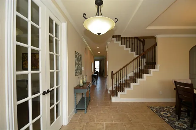 a view of a dining room with furniture wooden floor and chandelier
