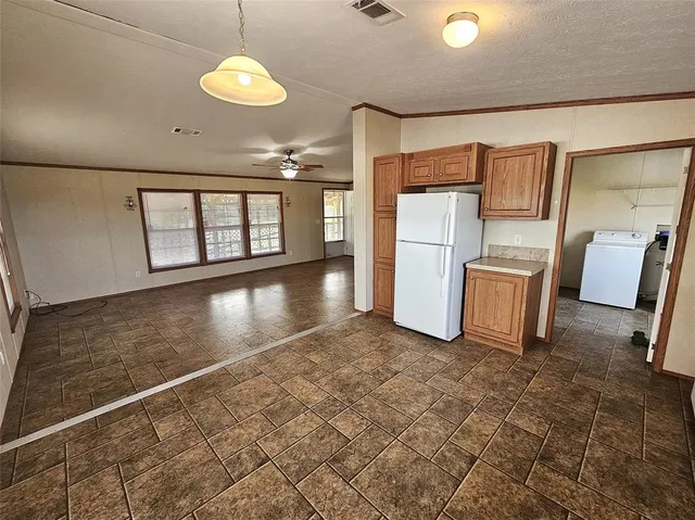 a view of a kitchen with a sink