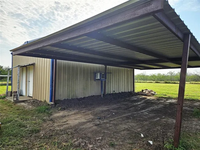a view of a backyard of the house