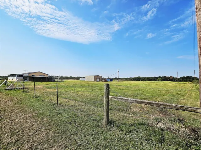 a view of a lake with a big yard