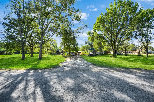 a view of a house with backyard porch and garden