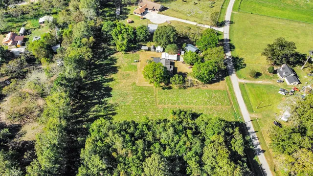 a kitchen with stainless steel appliances a stove a sink a microwave and cabinets
