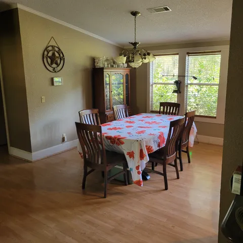 a room with gym equipment and view of living room