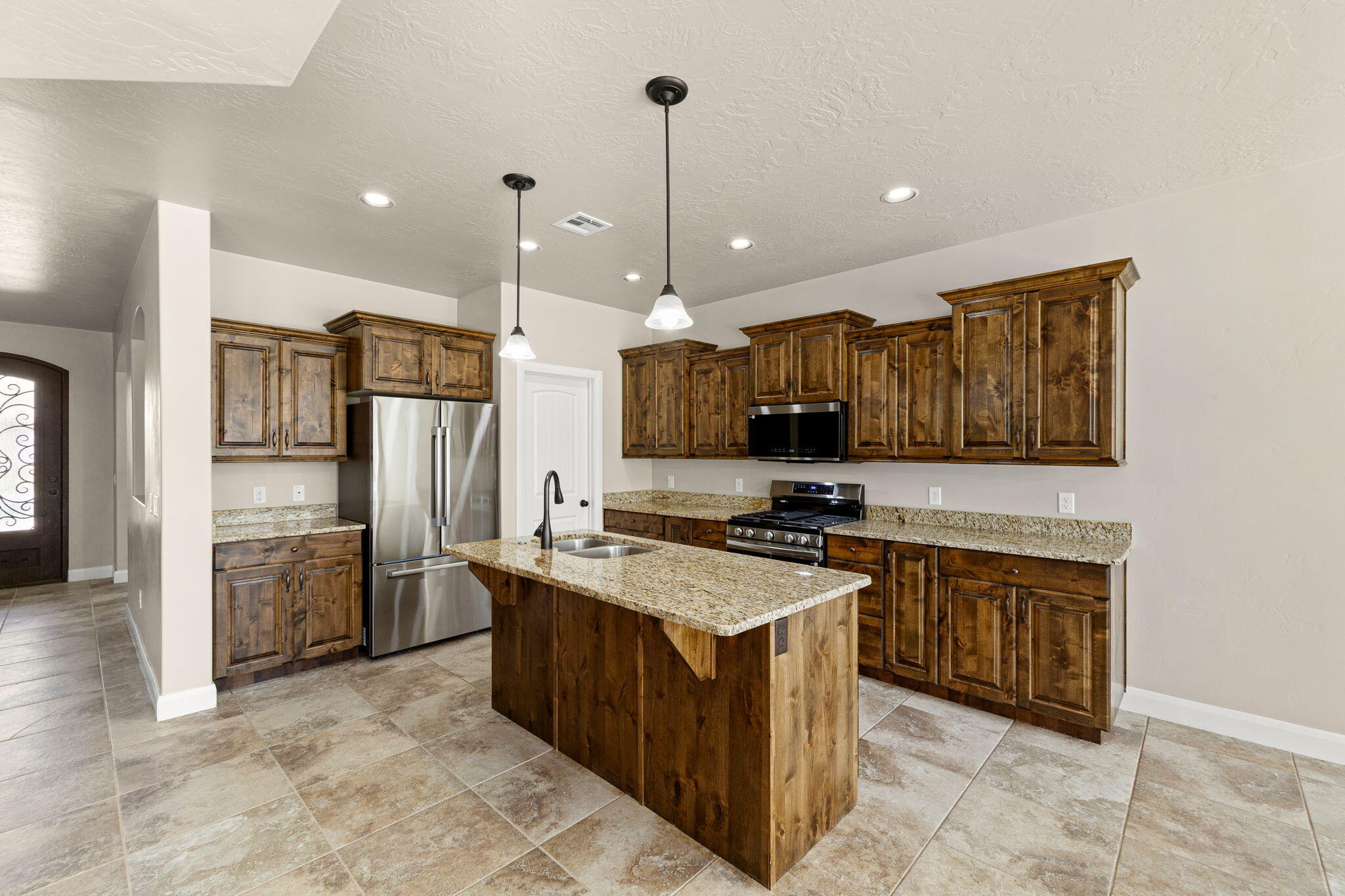 1157 Plantations Drive St. George, UT 84770 - Photo 8 of 31 Kitchen w/New Stainless Refrigerator, Stove & Microwave