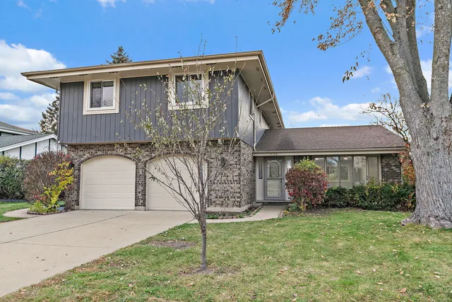 front view of a house with a yard