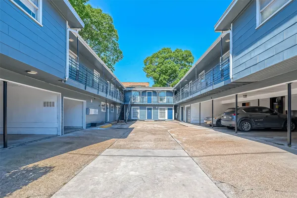 a view of a car park in front of house