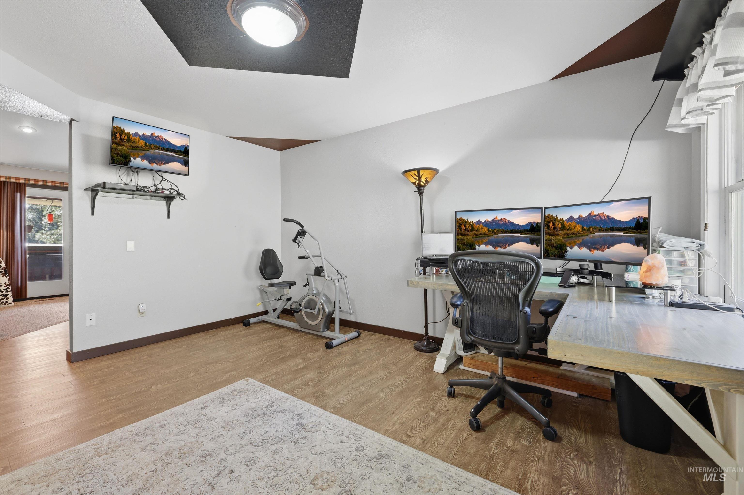 95 Johnson Creek Road Boise, ID 83716 - Photo 11 of 49 Office area with light wood-style flooring and baseboards