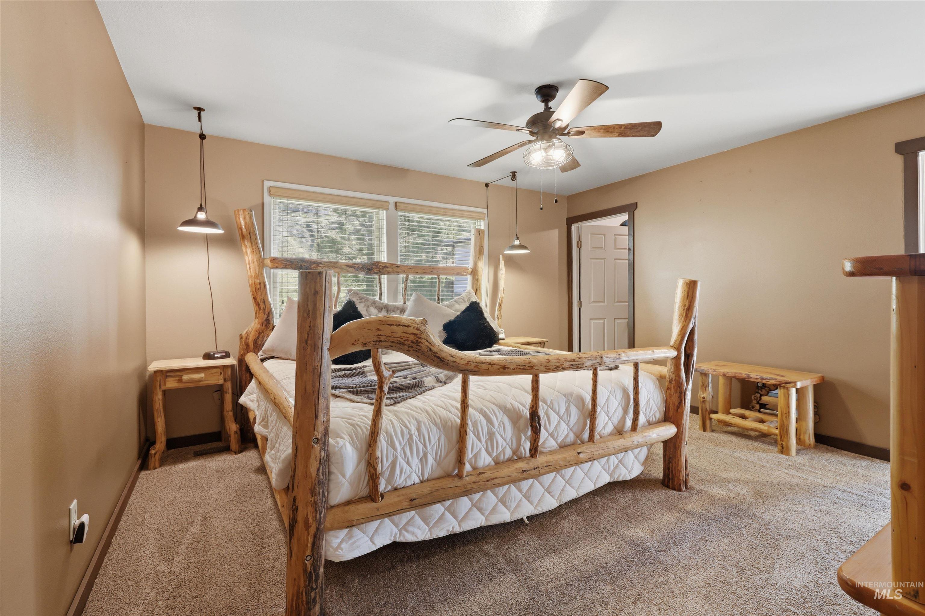 95 Johnson Creek Road Boise, ID 83716 - Photo 27 of 49 Bedroom with a ceiling fan and carpet floors
